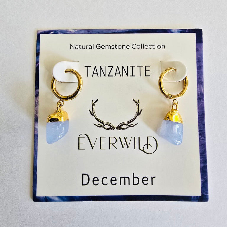 Tanzanite earrings on a 'Everwild' branded card with a white background