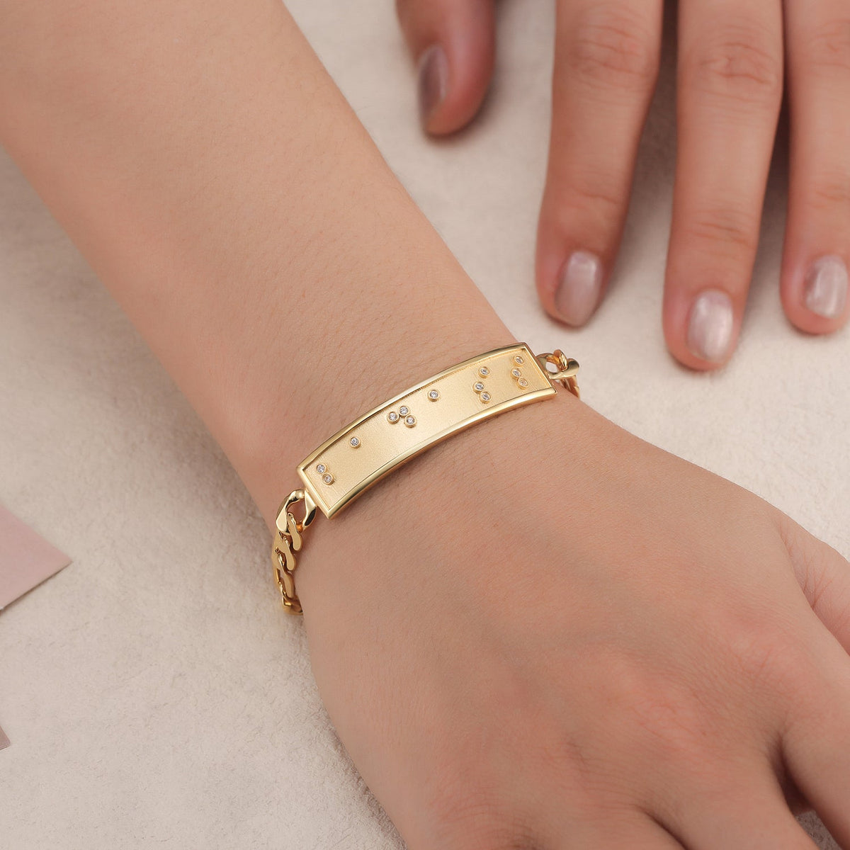 Touchstone Badass ID Link Bracelet in Gold with Braille Crystals on Model