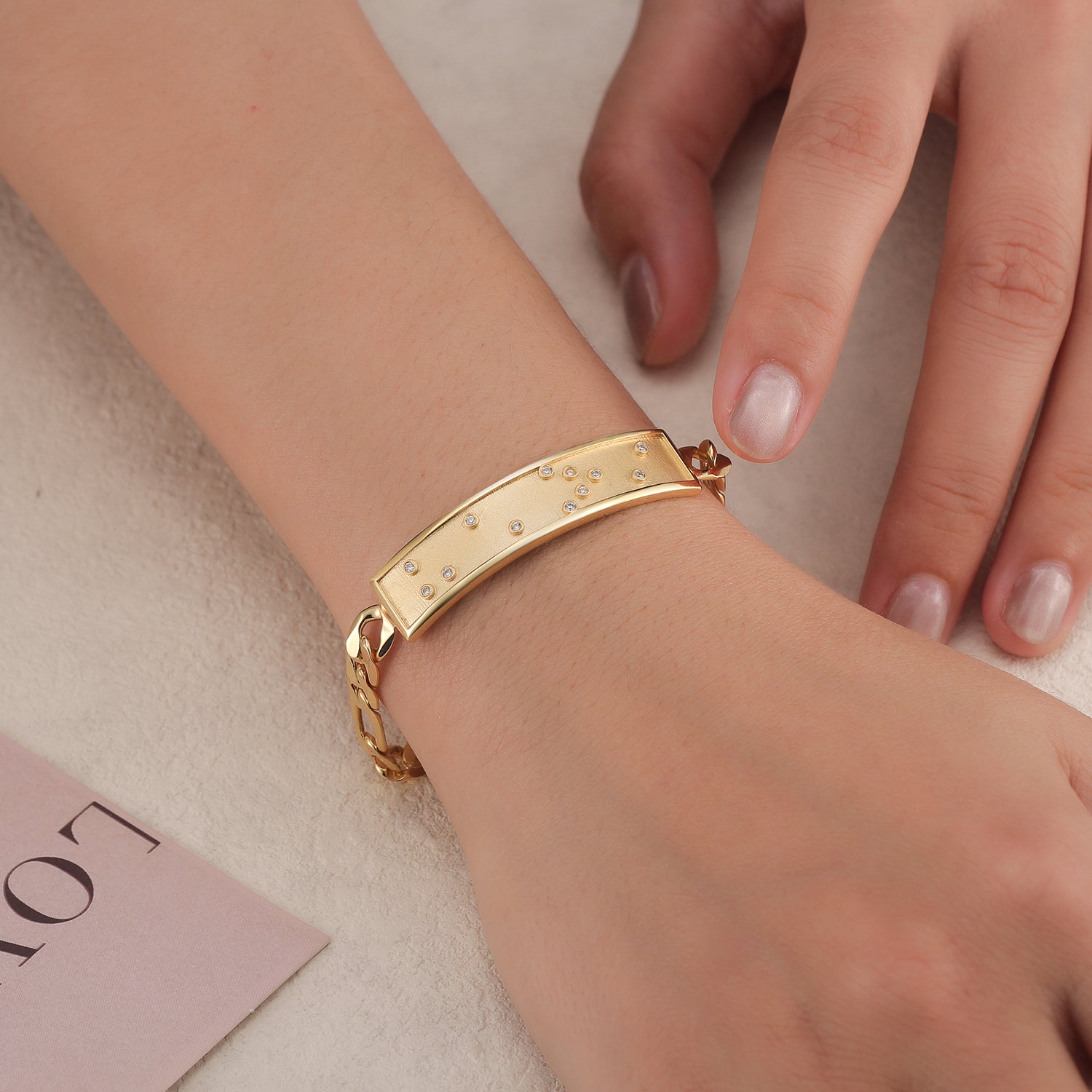 Touchstone HE>i ID Link Bracelet in Gold with Braille Crystals on Model