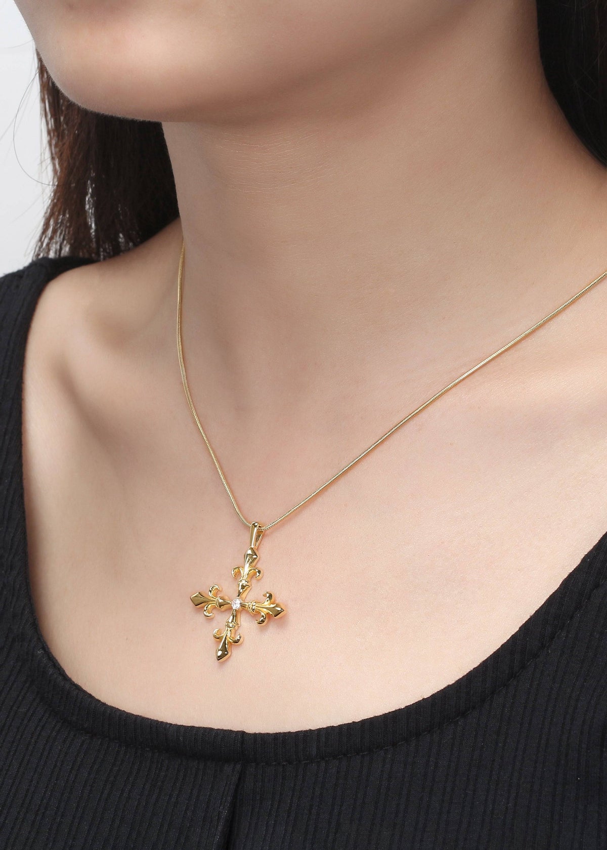 Saints and Saviors Fleur Madrigal Cross Necklace in Gold on model