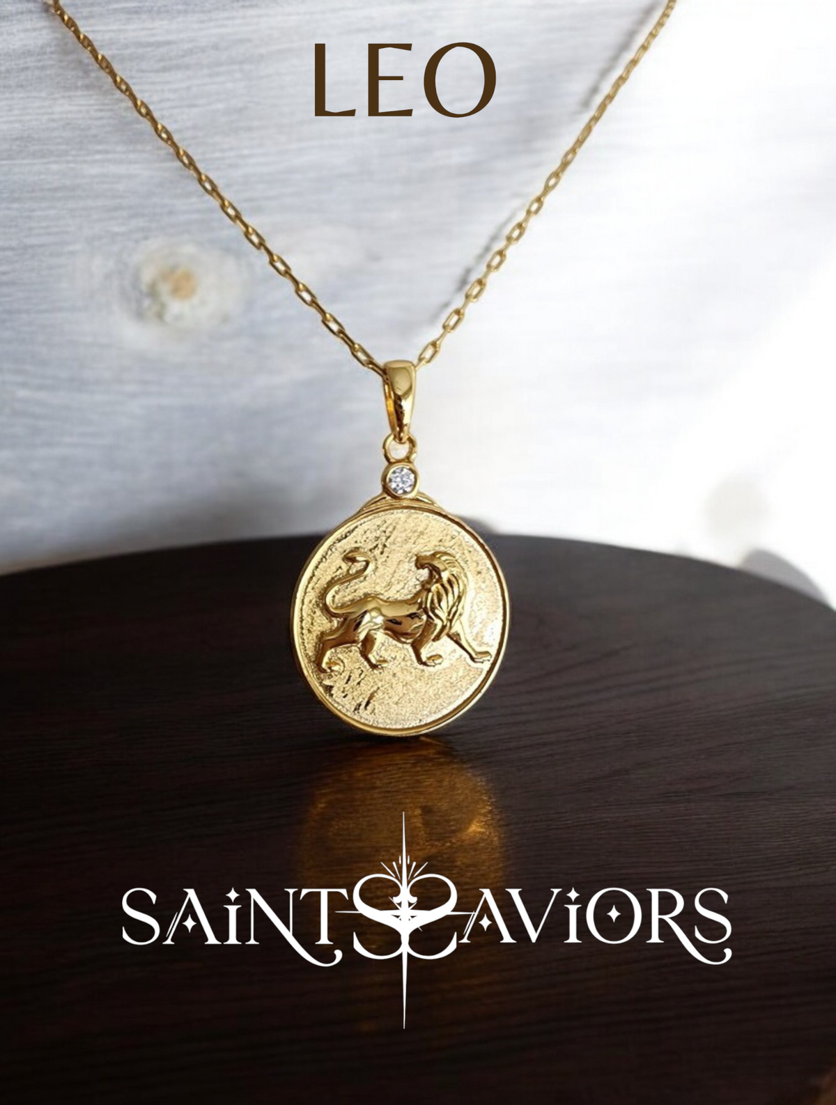 Gold necklace with a Leo lion Zodiac pendant on a wooden surface