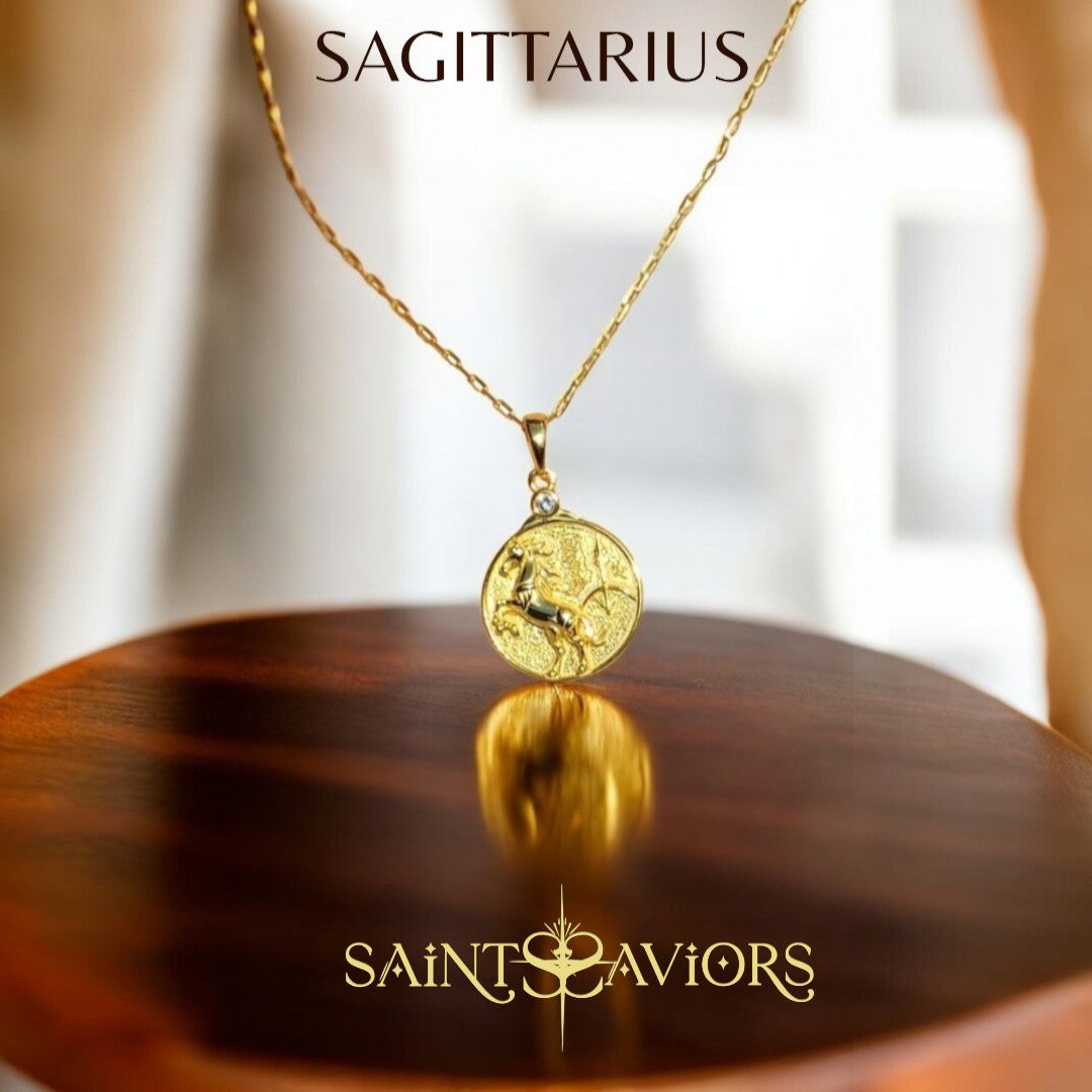 Gold Sagittarius Zodiac necklace on a wooden surface