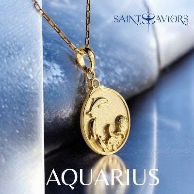 Gold Aquarius Zodiac pendant necklace on a reflective surface
