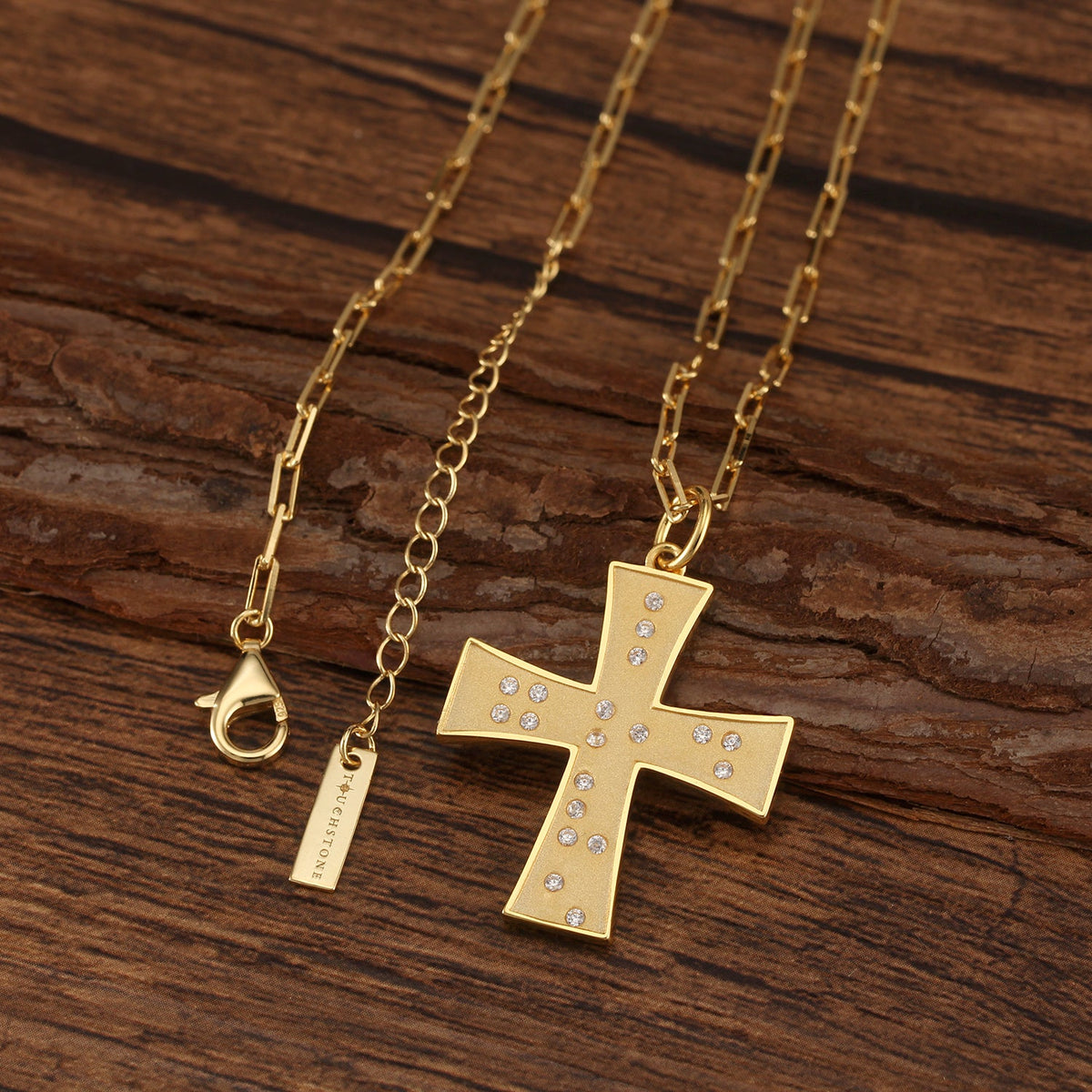 Touchstone Cross God/Love Braille Crystals Necklace Gold on wooden surface