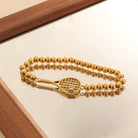 Lovematch Gold beaded stretch bracelet with tennis racket detail