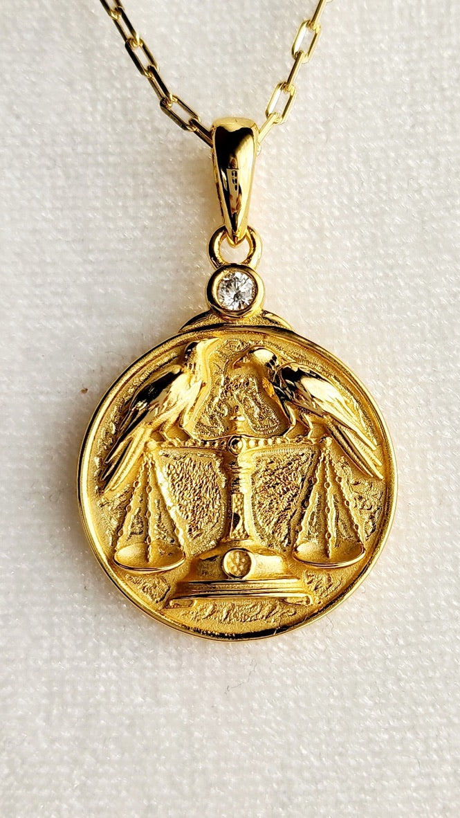 Gold Zodiac Libra V2 Necklace Depicting Two Ravens on a Scale
