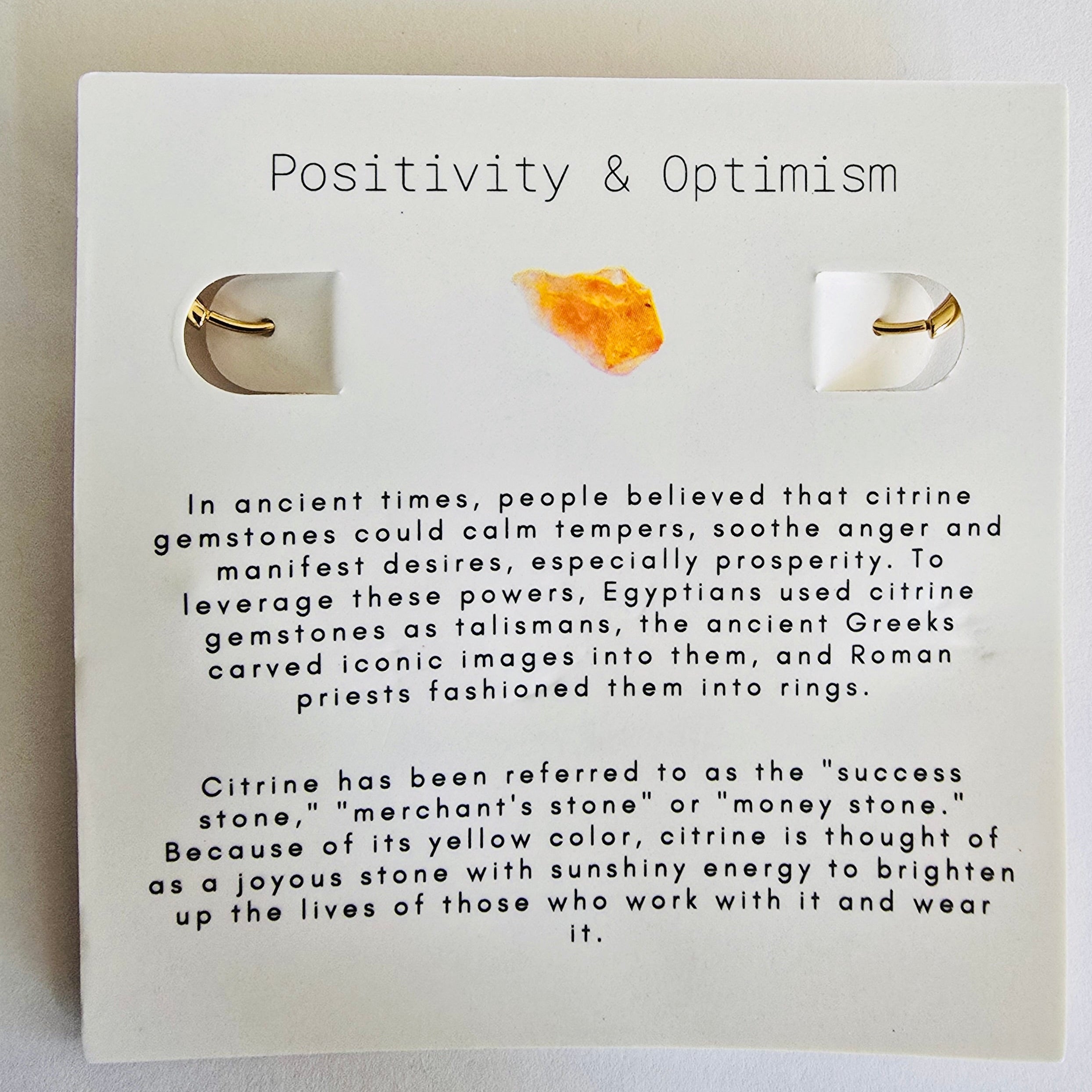 November Birthstone information on a card with text about positivity, optimism, and citrine gemstones.
