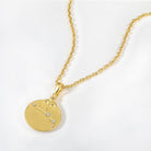 Gold necklace with a zodiac Aries constellation pendant on a white background