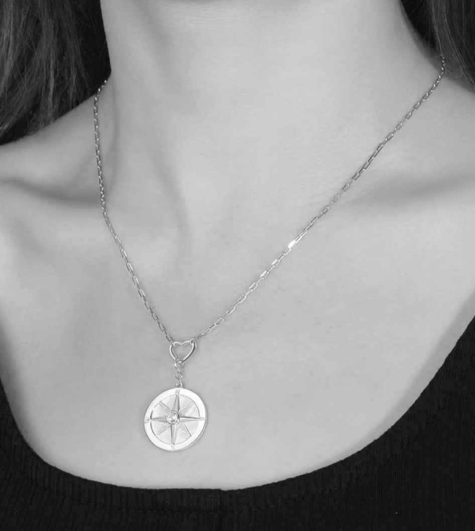 Saints and Saviors We Wander Compass on Heart Necklace Silver on Model