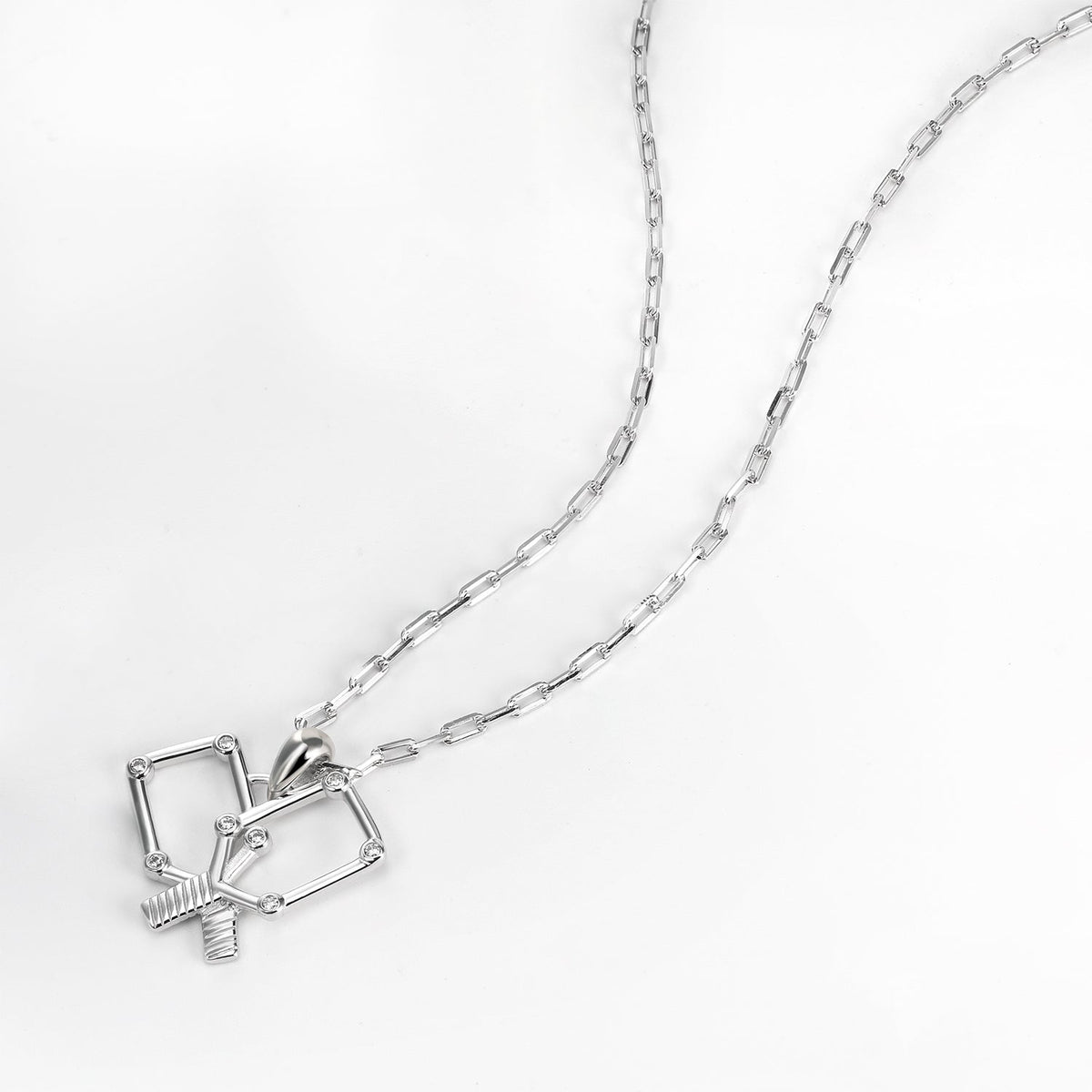 Silver necklace with a unique crossing pickleball paddles pendant on a white background