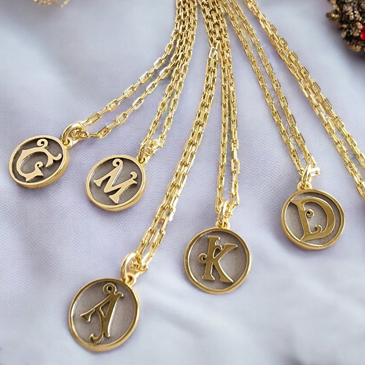Saints and Saviors Dainty Fancy Initial Pendant Necklace A-Z several letters shown on a white background