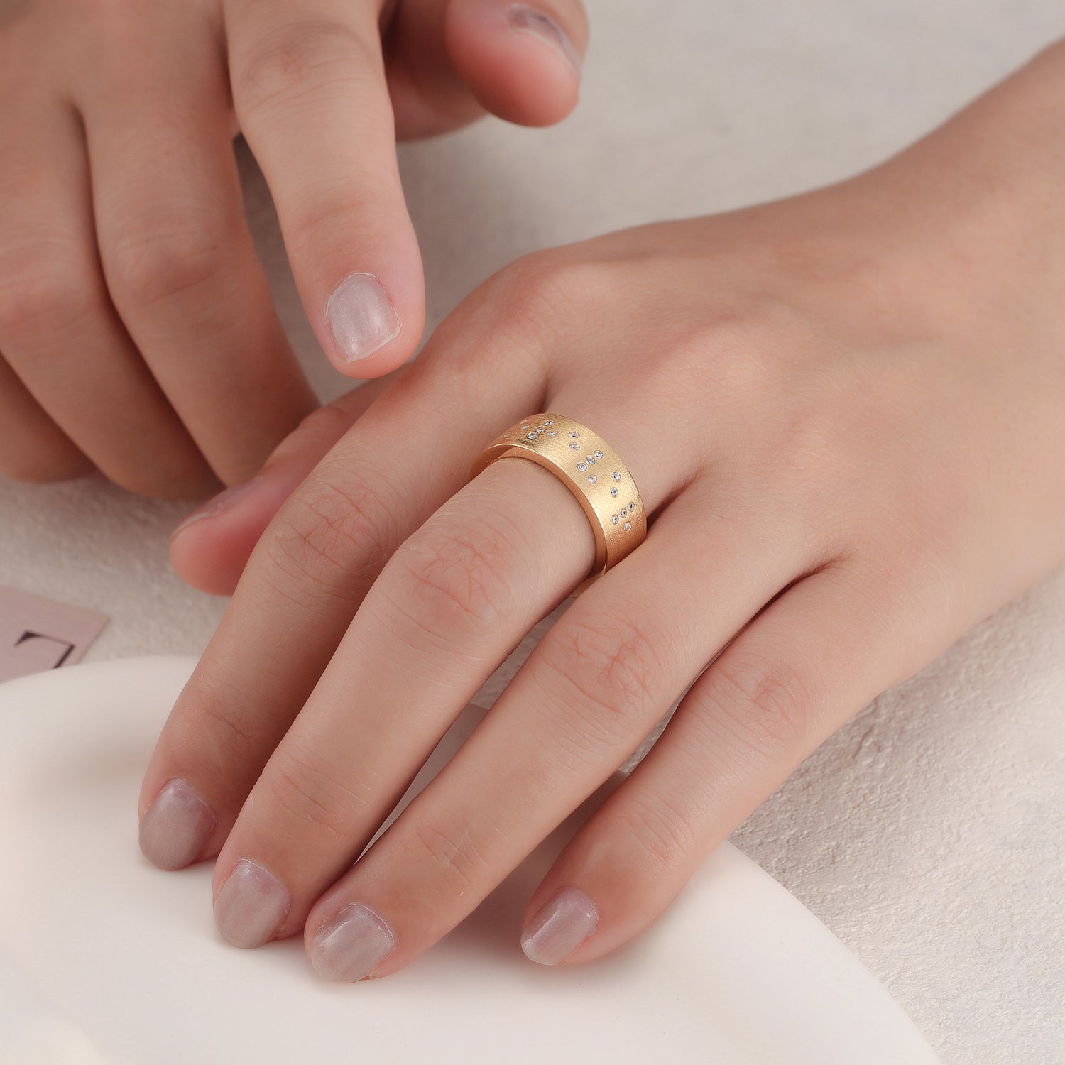 Touchstone 'Forever' Braille Band Ring Brushed Gold with Crystals on Model