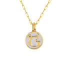 Saints and Saviors Dainty Fancy Initial Pendant Necklace gold letter G on small silver disc