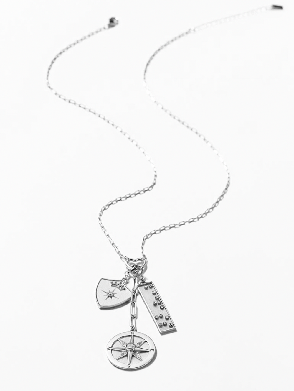 Protected Wanderer Three Charm Necklace with Compass Charm, Shield Charm and Braille Badass Crystal Bar Charm in Silver
