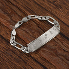 Touchstone Tribe ID Link Bracelet in Silver with Braille Crystals on wooden surface