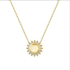 The Friendship Necklace Gold Sunburst with etched friendship symbol on white background