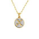 Saints and Saviors Dainty Fancy Initial Pendant Necklace gold letter X on small silver disc